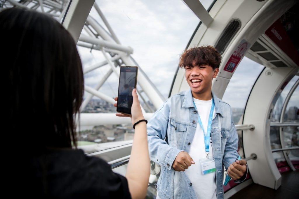 Students taking pictures at London Eye