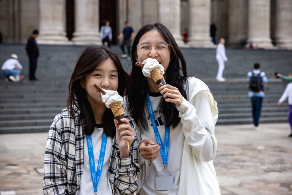Girls eating ice cream at Language in Action trip to St Paul's Cathedral