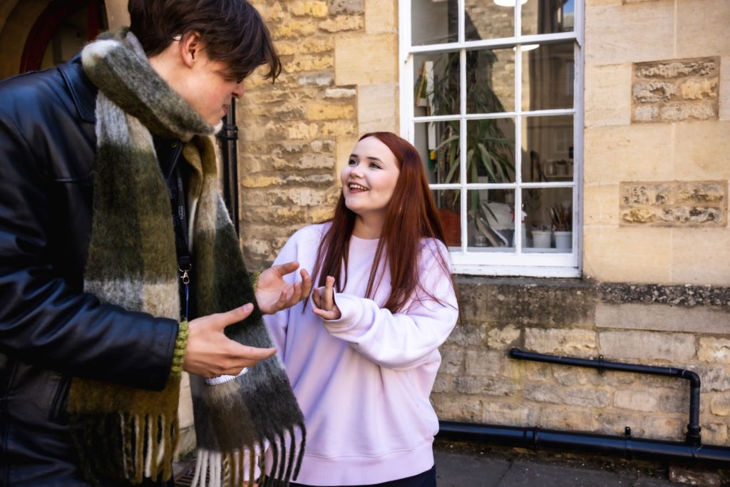Global Futures students walking at Oundle School cloisters