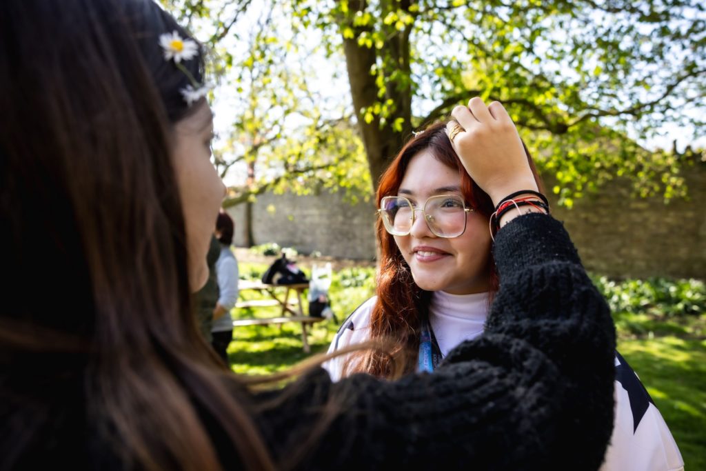 Girls with daisy chains at Oundle School