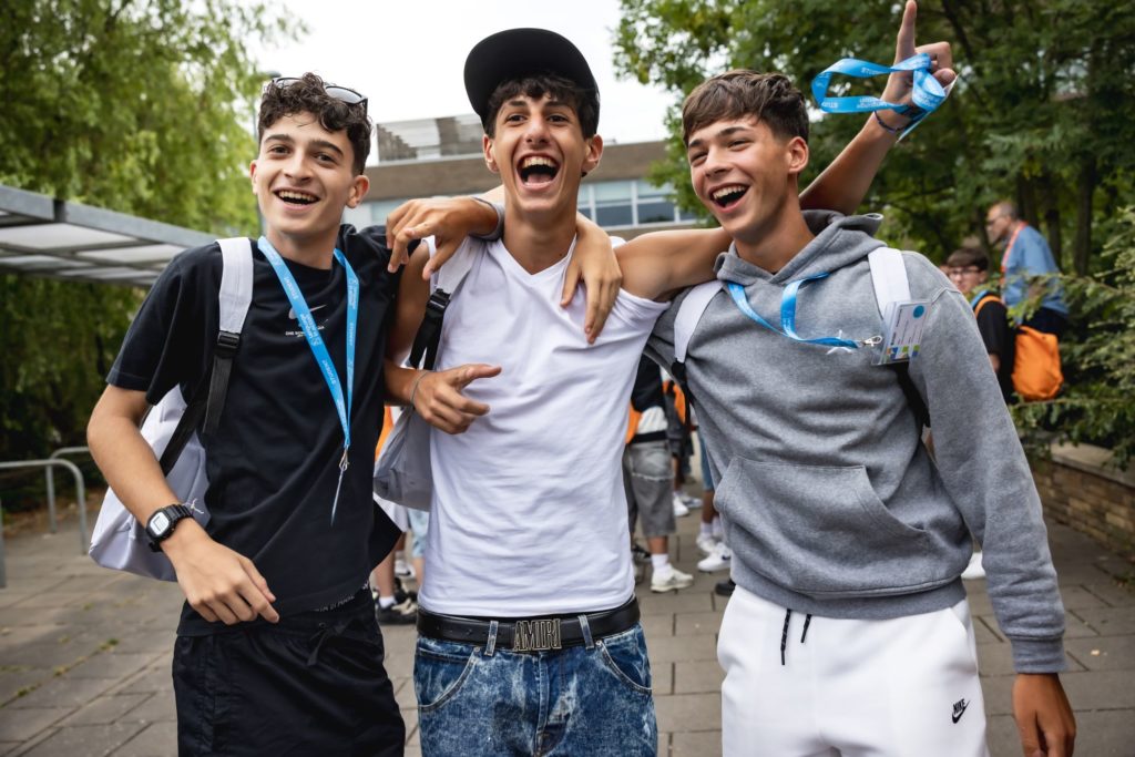 Three boys celebrating at Wembley Centre, Language in Action