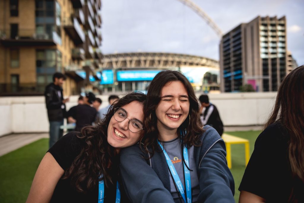 Girls laughing on the balcony of the Wembley accommodation