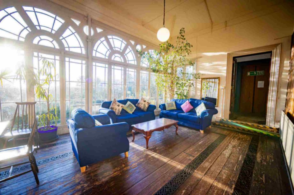 Beechwood common area with sofas and large windows